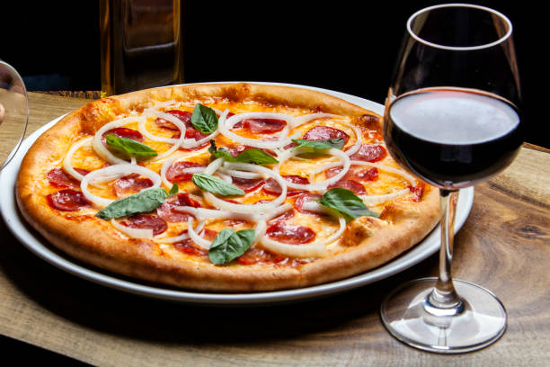 Pepperoni pizza and red wine