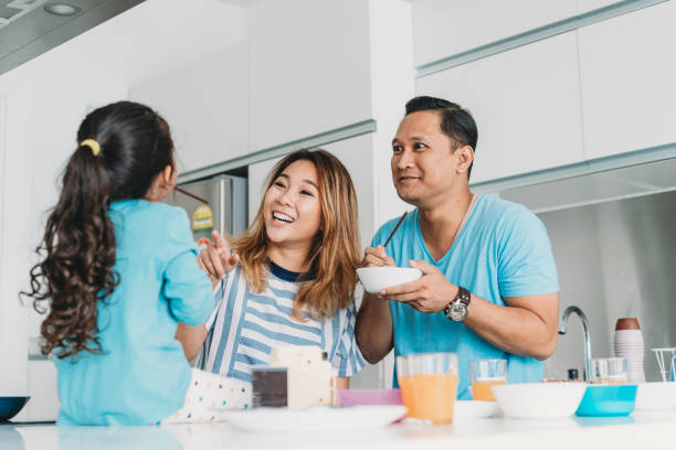 istock Affectionate family preparing breakfast at home 1138845974