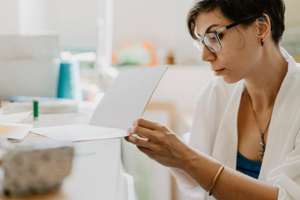 istock Young adult woman making a notebook 1138847776