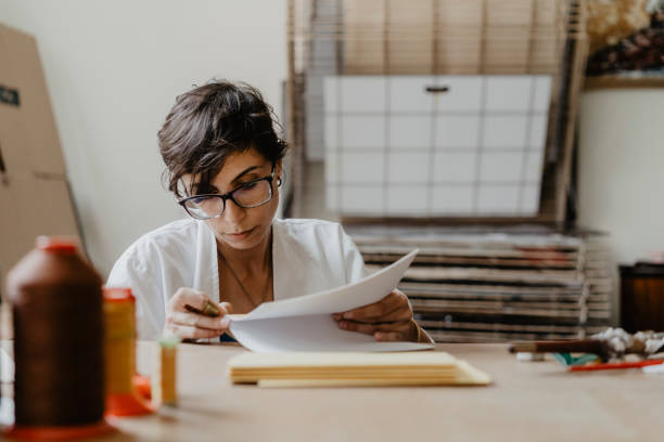 istock Young adult woman making a notebook 1138847779