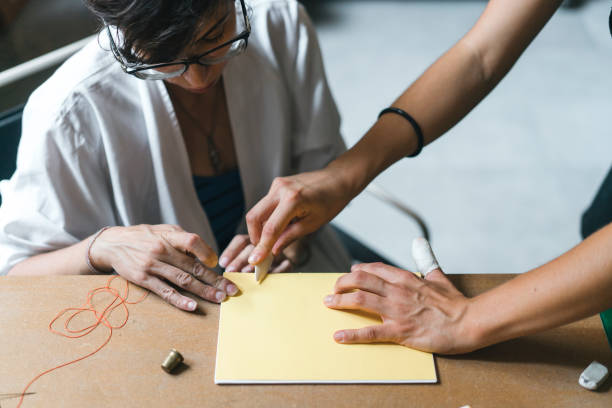 istock Young adult woman making a notebook 1138847806