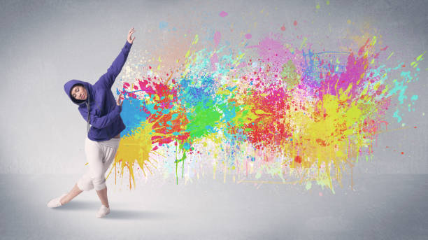 istock Young colorful street dancer with paint splash 1138847949