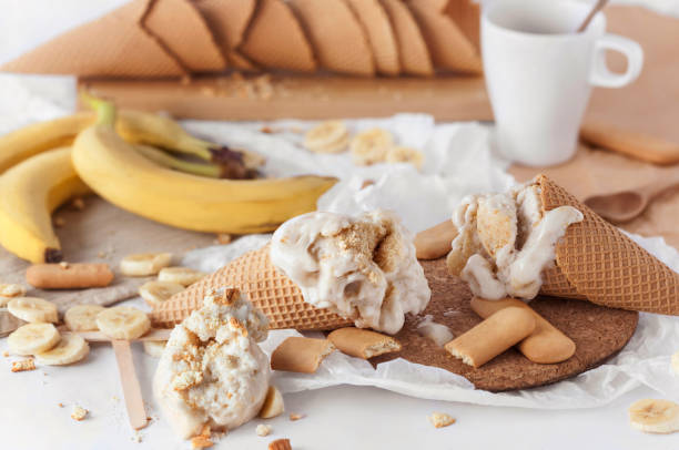istock Delicious ice cream in cones with bananas and biscuits 1138848981