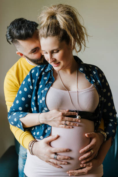 istock Future parents couple together at home 1138849062