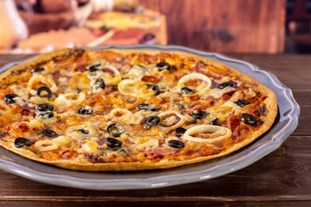 istock Recipe of pizza capriciosa with rustic kitchen 1138850901