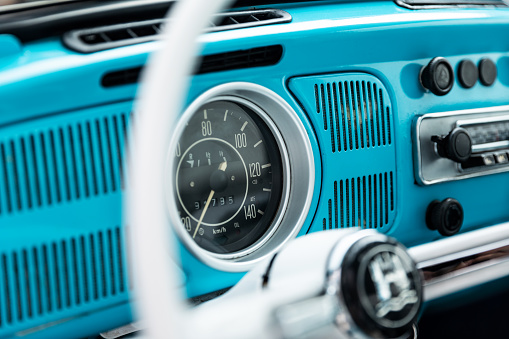Izmir, Turkey - February 8, 2019: Close up shot Speedometer, dashboard and radio of a Volkswagen beetle.