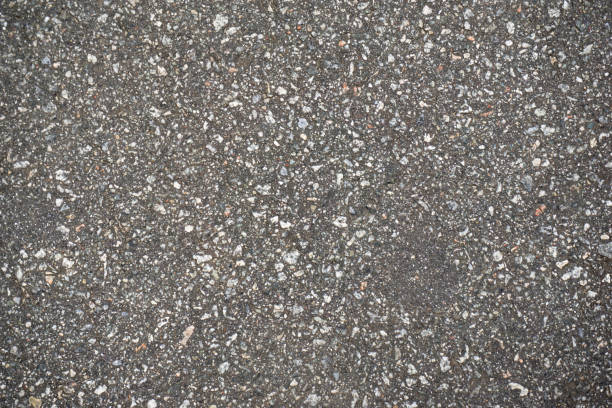 istock destructed tar road in a town 1138853816