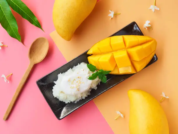 Mango sticky rice, famous Thai dessert for a summer season in top view.