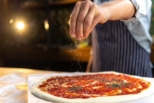 Pizza being prepared