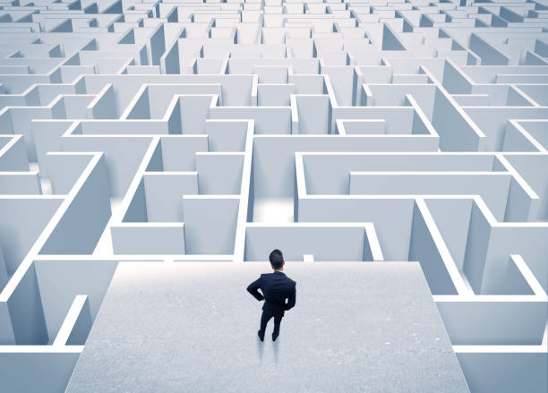 istock Businessman staring at infinite maze 1138854528