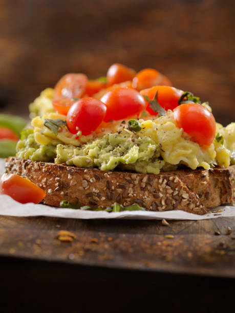 istock Creamy Avocado Sandwich with Scrambled Eggs and Tomatoes 1138854535
