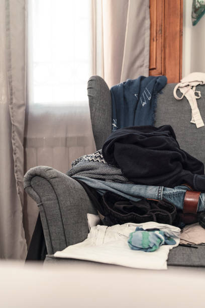 istock Messy room with scattered clothes on the armchair 1138859257