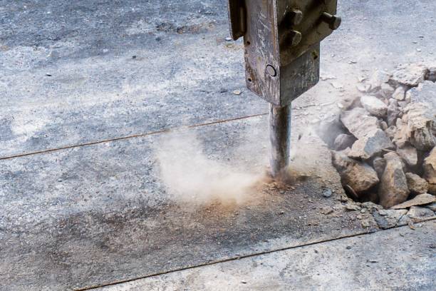 istock excavator jack hammer in action and text space 1138860079