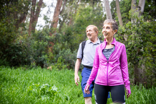 istock Senior Couple Hiking in Forest 1138861659