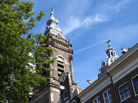 Facades and architecture of buildings in Amsterdam on a clear day