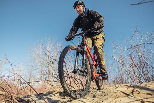 istock Caucasian man biking in wilderness 1138863266