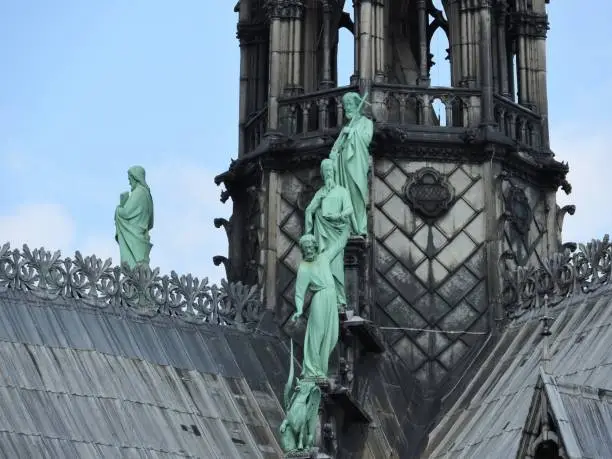 Photo of Statues of the apostles on the roof of Notre Dame, the approach of fragments. Paris France, UNESCO world heritage site.