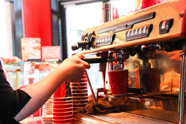 istock Female Barista making coffee 1138864922