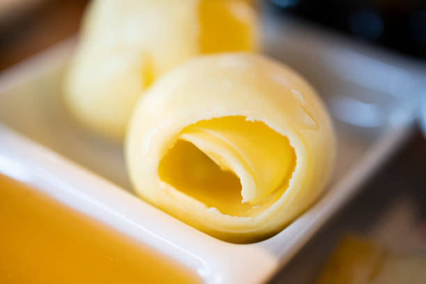 Old wooden table with a portion of Butter and honey (selective focus; close-up shot) Butter, Margarine, Cooking Oil, Bread, Preparation butter margarine isolated portion stock pictures, royalty-free photos & images