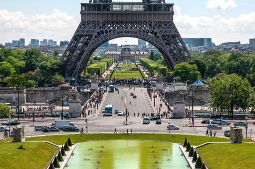 A street picture of Paris, with the Eiffel Tower in the centre.