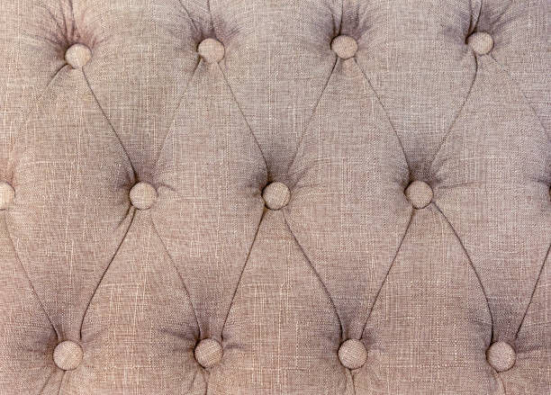 istock Carriage coupler. Panel of beige fabric made by the method of a carriage coupler. 1138867736