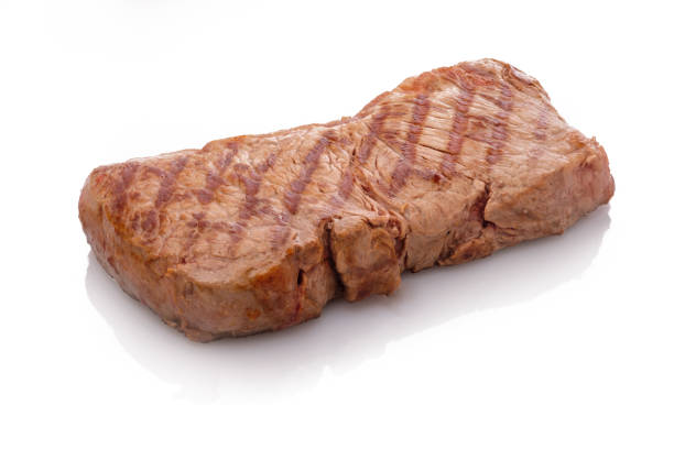 Ribeye steaks grilled on a barbecue