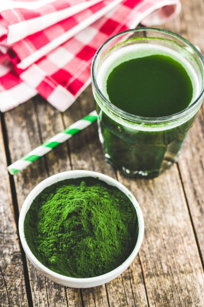istock Green chlorella powder and drink. 1138867913