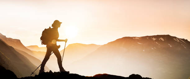 istock Female silhouette hiking 1138868449