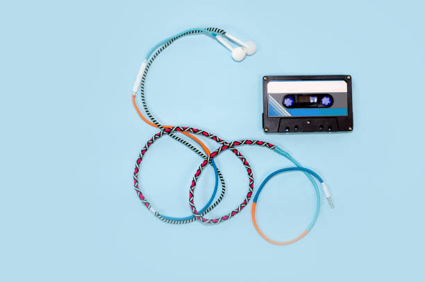 istock Top view retro tape cassette with colourful earphone 1138868577