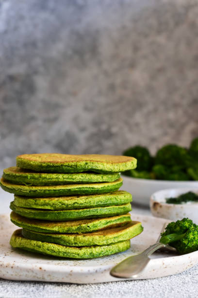 istock Green pancakes with spinach on a light concrete background. Classic breakfast. 1138870456