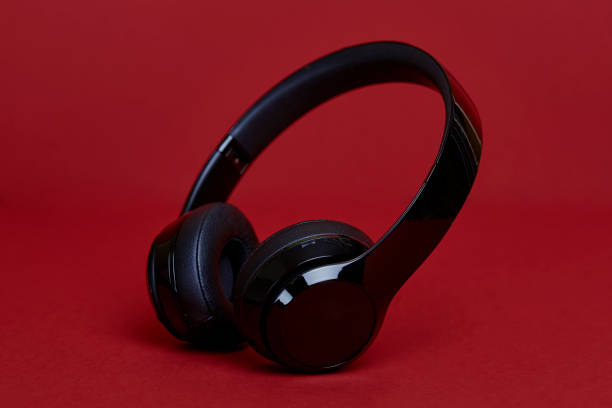 istock Black Headphones on a Red Background 1138871135