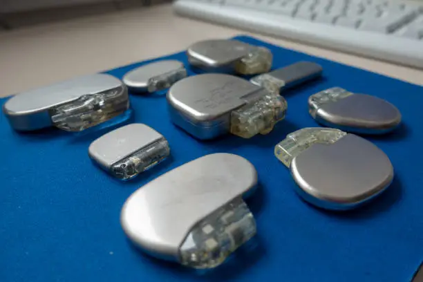 Photo of various explanted pacemakers and defibrillators and event recorders
