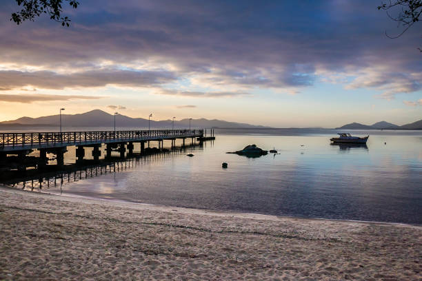 istock sunrise on a calm beach 1138871725
