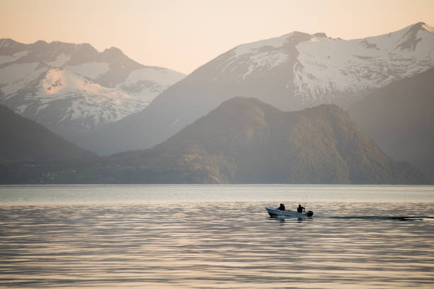 istock Fishing boat in sunset 1138872822
