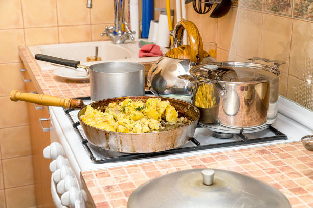 istock Fried potatoes with dill in a pan on gas stove 1138873059