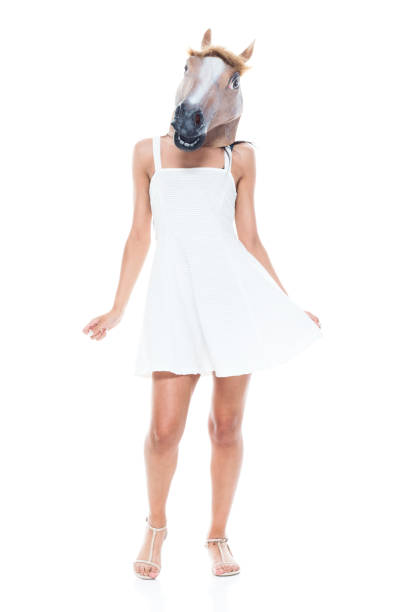 istock Cute female wearing a horse head 1138873613