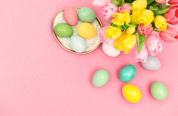 istock Easter eggs spring tulip flowers decoration pink background 1138876195