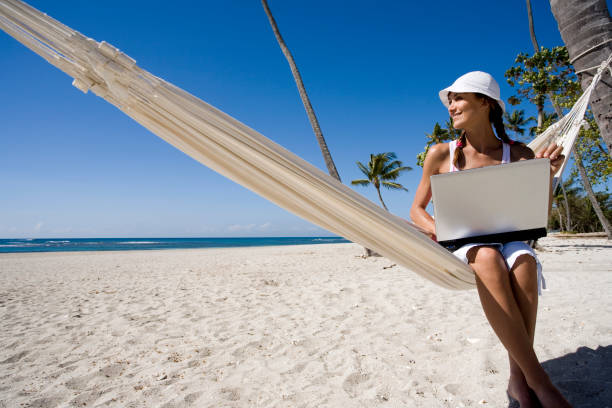 istock woman in a hammock on the beach 1138876638