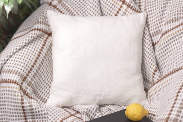 istock White linen pillow on a chair in cozy room, mockup 1138876904