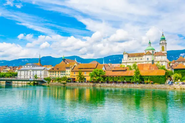 Riverside of Aare passing through Solothurn is dominated by Saint Ursus Cathedral, Switzerland