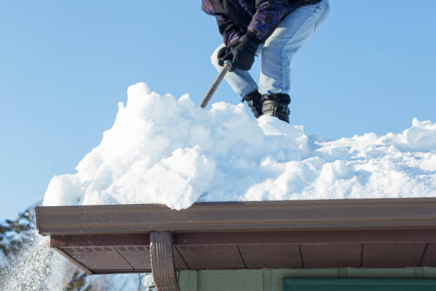istock Man Shoveling Deep Snow Off a Rooftop 1138880527