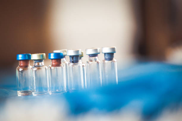 istock Vaccine bottles medical background 1138881368
