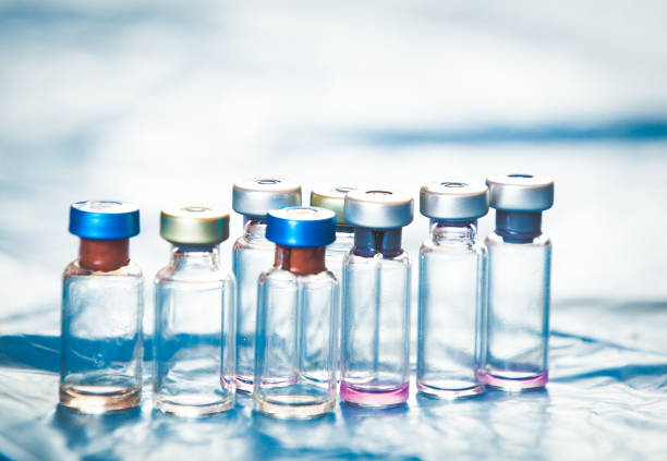 istock Vaccine bottles medical background 1138881392