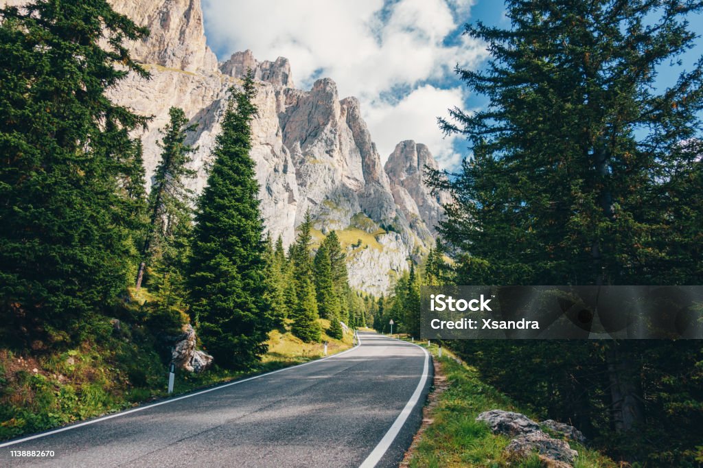 Scenic road through the forest in the Dolomites Alps, Italy Scenic road in the Dolomites Alps, Italy Road Stock Photo