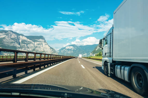 istock Car passing a truck on the highway, view through the windshield 1138882805