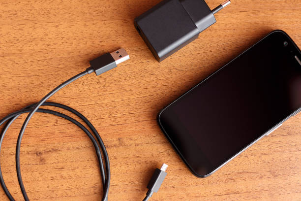istock Phone charger usb cable lay on the table 1138882891