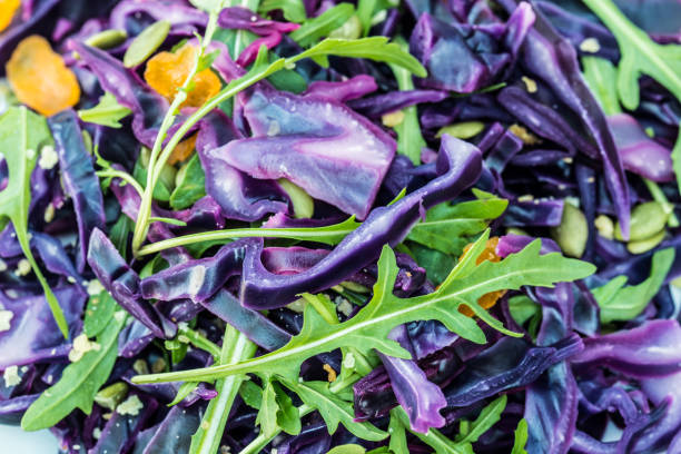 istock salad with red cabbage and arugula leaves 1138882943