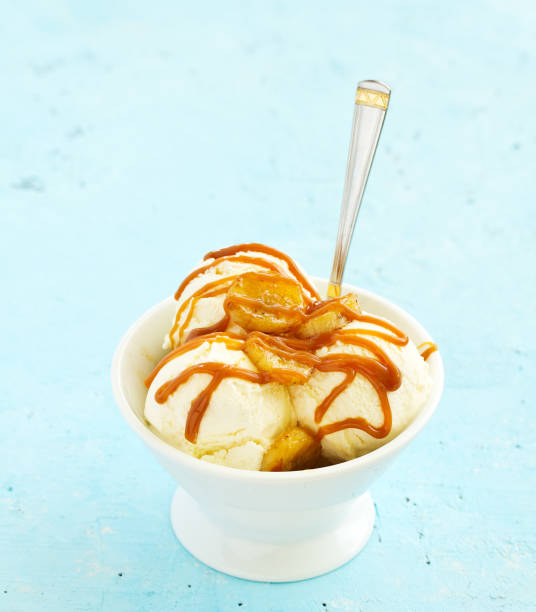 istock vanilla ice cream with bananas and caramel in a bowl. 1138884211
