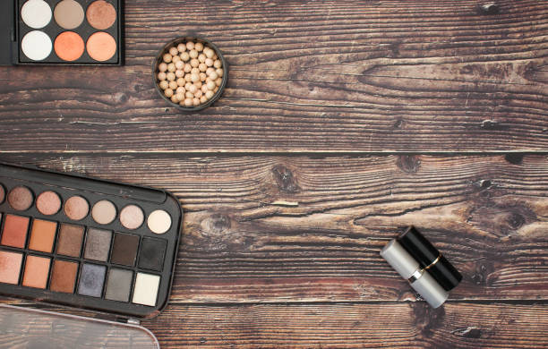 istock Eye shadow and make up products on wooden background 1138885439