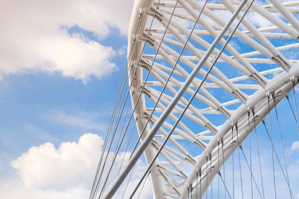 Detail of the iron structure of the modern bridge Settimia Spizzichino in Rome with the sky in the background stock photo